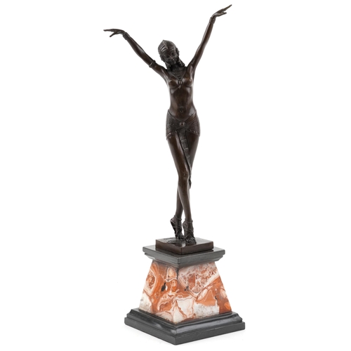 339 - A patinated bronze study of an Art Deco female dancer raised on a marble base, 56cm high.