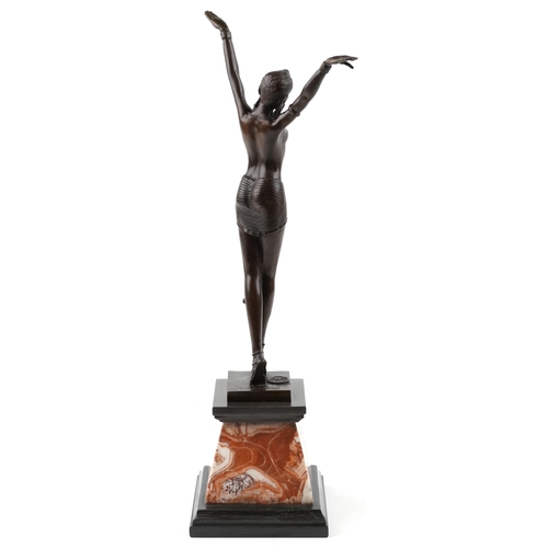 339 - A patinated bronze study of an Art Deco female dancer raised on a marble base, 56cm high.