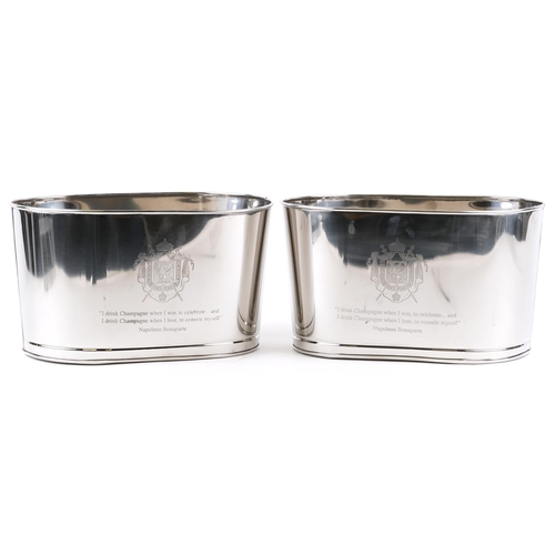 1034 - A pair of polished metal Champagne ice buckets with Napoleon Bonaparte and Lily Bollinger mottos, ea... 