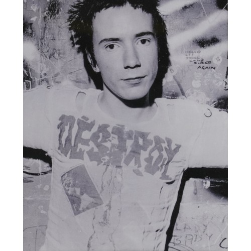 1045 - ** WITHDRAWN **A black and white photograph of Johnny Rotten of The Sex Pistols with a signature tog... 