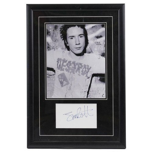 1045 - ** WITHDRAWN **A black and white photograph of Johnny Rotten of The Sex Pistols with a signature tog... 