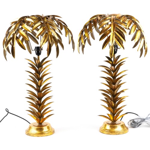 2169 - A pair of Hollywood Regency style gilt painted metal table lamps in the form of palm trees, each 73c... 