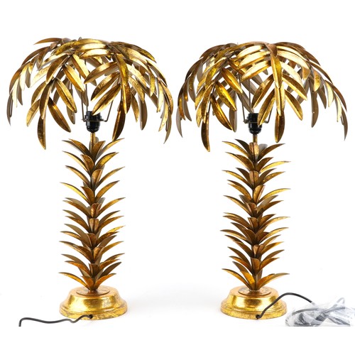 2169 - A pair of Hollywood Regency style gilt painted metal table lamps in the form of palm trees, each 73c... 