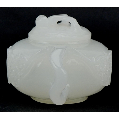 208 - A Chinese white jade teapot and cover, 20th century, with carved naturalistic decoration, 18cm wide.