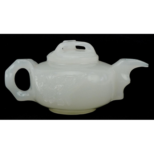 208 - A Chinese white jade teapot and cover, 20th century, with carved naturalistic decoration, 18cm wide.