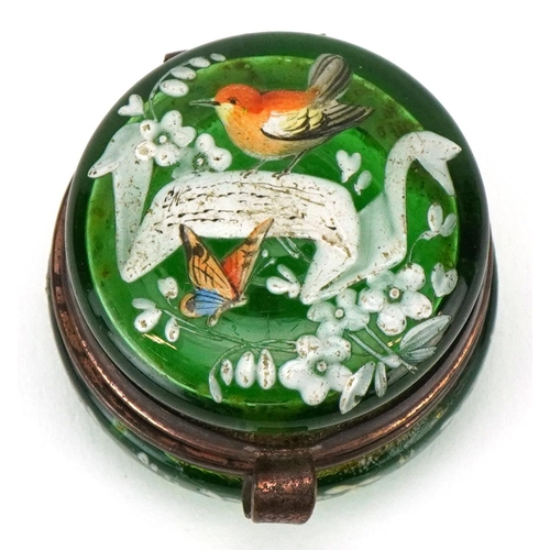 271 - A 19th century French green glass and enamelled pillbox decorated with birds and insects, with a gil... 