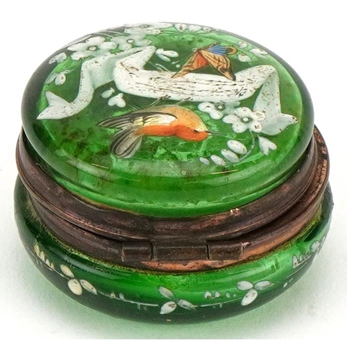 271 - A 19th century French green glass and enamelled pillbox decorated with birds and insects, with a gil... 