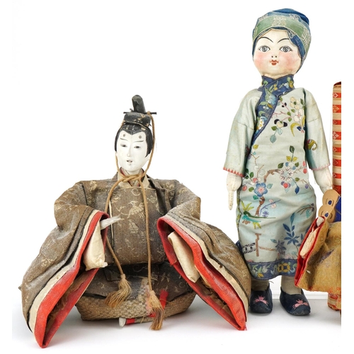 1094 - A group of three Chinese dolls, 20th century, various designs, the largest 31cm in length.