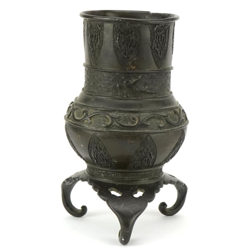 178 - A Chinese bronze archaistic style tripod censer, late 19th/early 20th century, decorated in relief, ... 