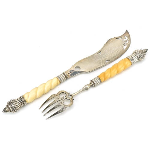 572 - A pair of mid Victorian silver fish servers, each with engraved decoration with reeded and foliate d... 