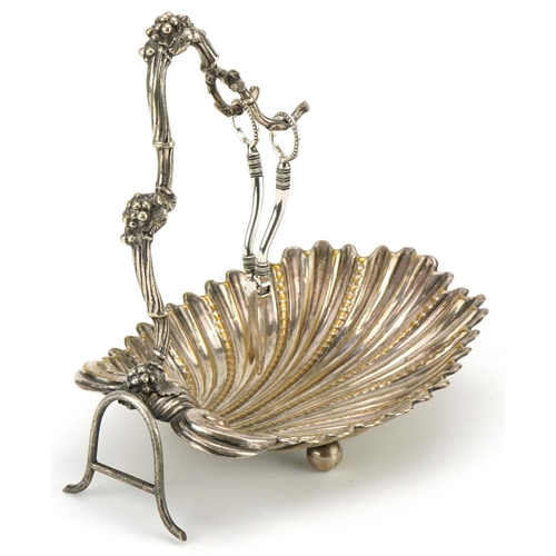 1095 - A Victorian plated centrepiece, the scalloped bowl with a naturalistic hanger, 32cm high, together w... 