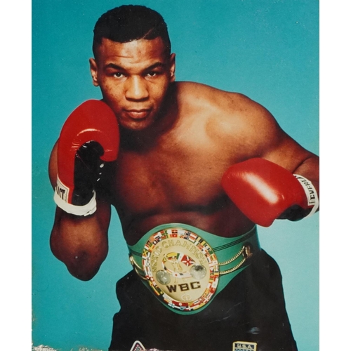 2306 - A small collection of sporting memorabilia relating to Mike Tyson including a colour advertising pos... 