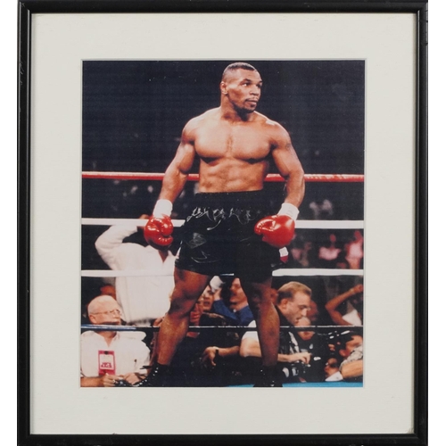 2306 - A small collection of sporting memorabilia relating to Mike Tyson including a colour advertising pos... 