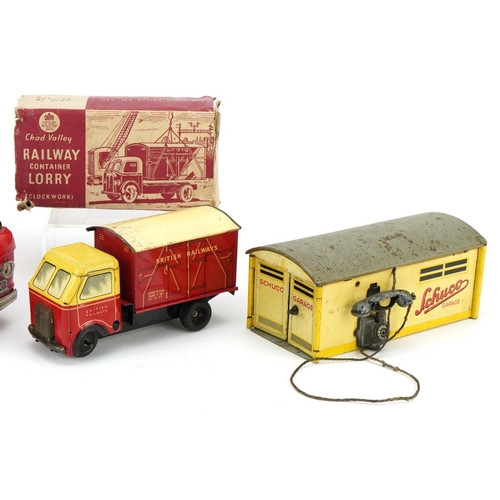 1331 - A mid 20th century Schuco tinplate garage, model number 1500, together with a Japanese tinplate post... 