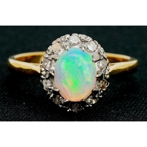 3085 - An 18ct gold cabochon opal and diamond ring, size L/M, 3.3g.