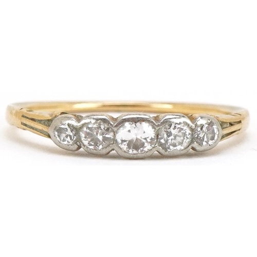 3128 - An 18ct gold graduated diamond five stone ring, size O, 1.7g.