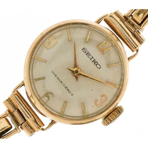 3071 - Seiko, a ladies 9ct gold manual wind wristwatch with 9ct gold strap, 20mm in diameter, total weight ... 