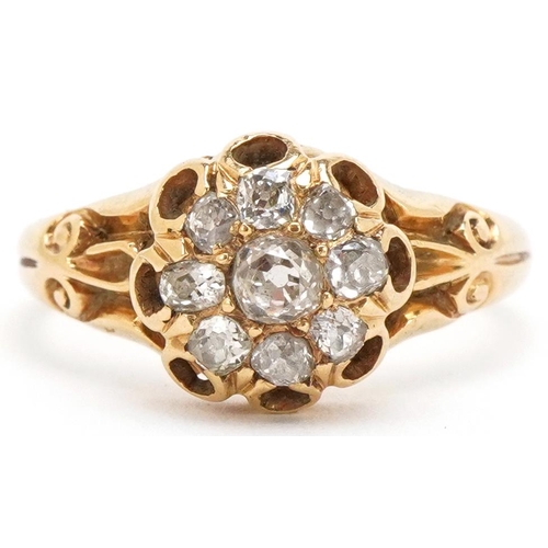 3012 - An unmarked 18ct gold diamond cluster ring with ornate setting, the central diamond approximately 3.... 