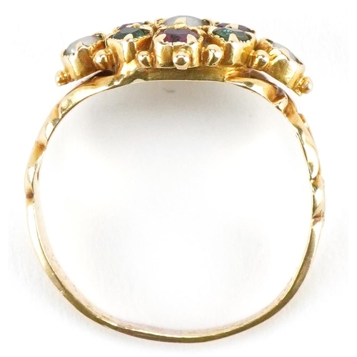 3023 - An early 20th century unmarked gold gem set ring in Suffragette colours, set with rubies, emeralds a... 