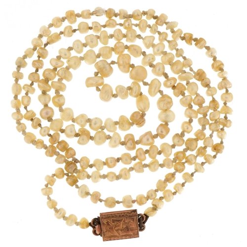 3479 - An antique pearl necklace with unmarked gold clasp, 70cm in length, 11.2g.