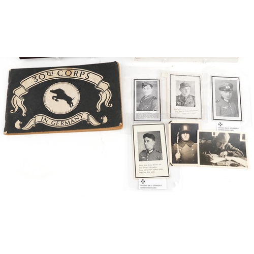 2442 - A collection of German militaria including World War II black and white photographs and death cards.