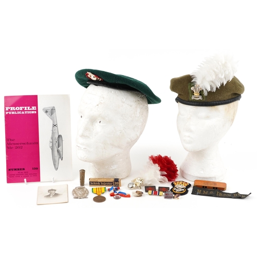 2426 - Militaria including a flat cap with Royal Marines badge, Royal Welsh beret, enamelled badges, HMS Ir... 