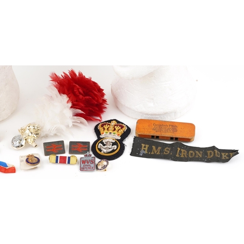 2426 - Militaria including a flat cap with Royal Marines badge, Royal Welsh beret, enamelled badges, HMS Ir... 