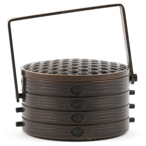 375 - A Japanese patinated bronze cricket cage in the form of a food carrier with swing handle, 8cm in dia... 