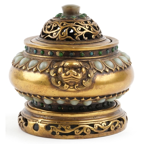 144 - A Chinese bronze censer and cover on stand set with jade coloured cabochons, with lion mask handles,... 