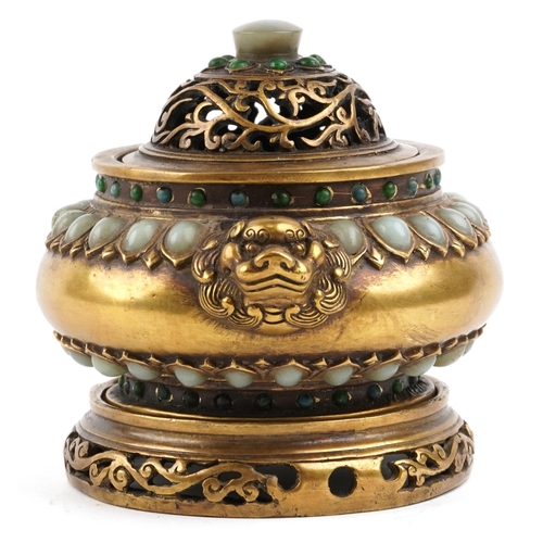 144 - A Chinese bronze censer and cover on stand set with jade coloured cabochons, with lion mask handles,... 