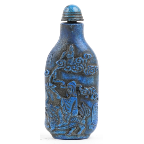 1085 - A Chinese carved hardstone snuff bottle and stopper, 20th century, decorated with figures, 8cm high.