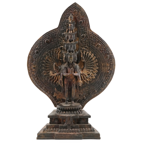 345 - A large Tibetan bronzed figure of a deity, 45cm high.