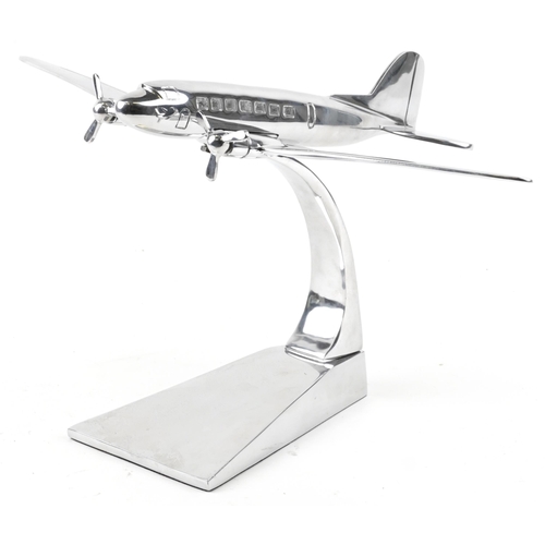 1163 - An aviation interest chromed model of an aeroplane, 41cm in length.