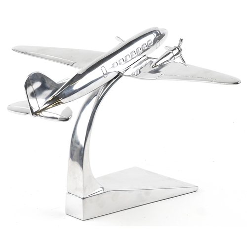 1163 - An aviation interest chromed model of an aeroplane, 41cm in length.