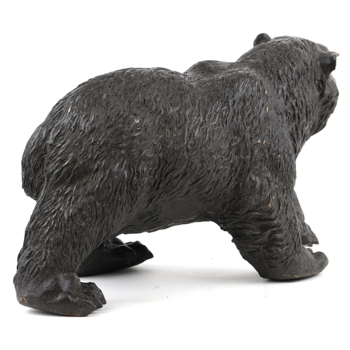 1091 - A patinated bronze study of a grizzly bear, 37cm in length.