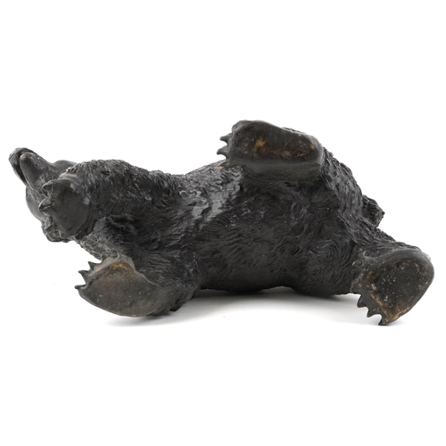 1091 - A patinated bronze study of a grizzly bear, 37cm in length.