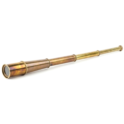 2439 - A brass three draw telescope, 62.5cm in length extended.