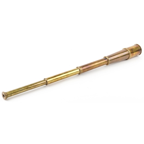 2439 - A brass three draw telescope, 62.5cm in length extended.