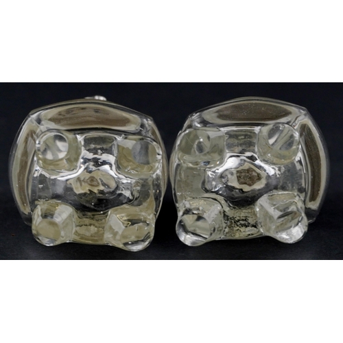 1080 - A pair of novelty glass salt and pepper casters with silver plated heads in the form of cats, each 1... 