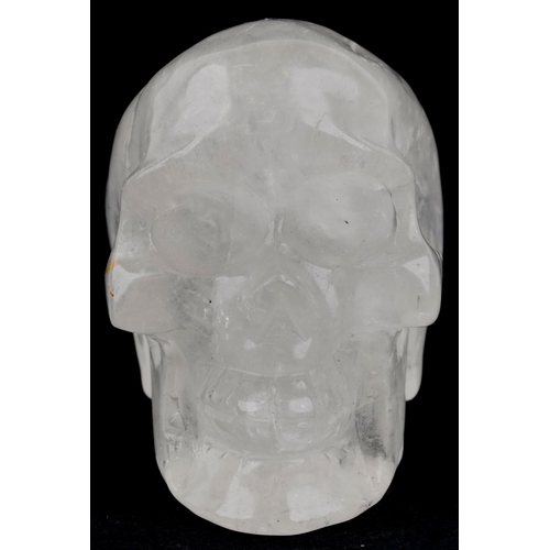 1116 - A novelty carved rock crystal model of a human skull, 11cm in length.