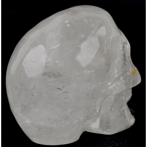 1116 - A novelty carved rock crystal model of a human skull, 11cm in length.