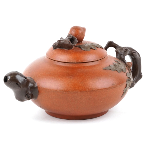 418 - A Chinese Yixing stoneware teapot, 20th century, with naturalistic decoration, 20cm in length.