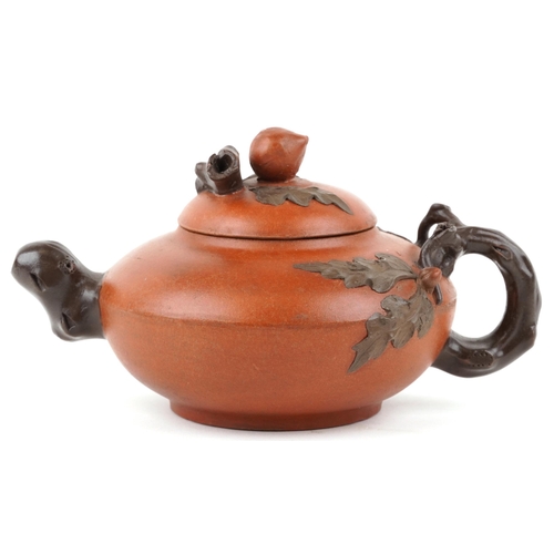 418 - A Chinese Yixing stoneware teapot, 20th century, with naturalistic decoration, 20cm in length.