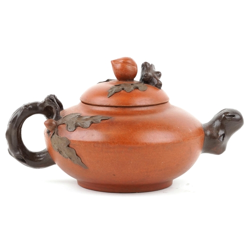 418 - A Chinese Yixing stoneware teapot, 20th century, with naturalistic decoration, 20cm in length.