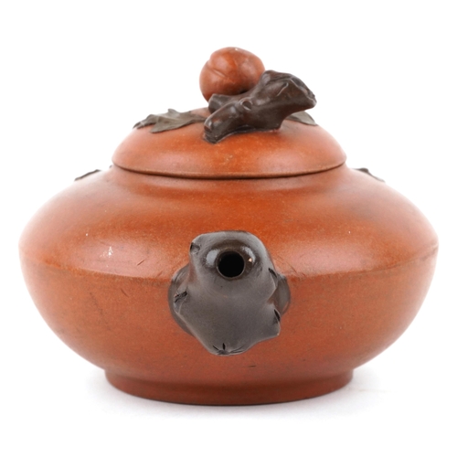 418 - A Chinese Yixing stoneware teapot, 20th century, with naturalistic decoration, 20cm in length.