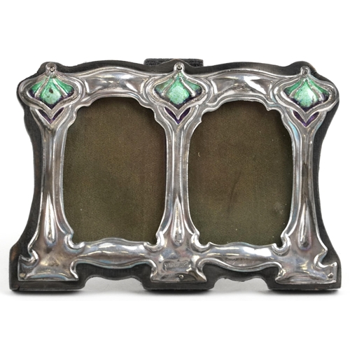 549 - An Art Nouveau style silver double photo frame embossed with stylized motifs, 11.5cm wide