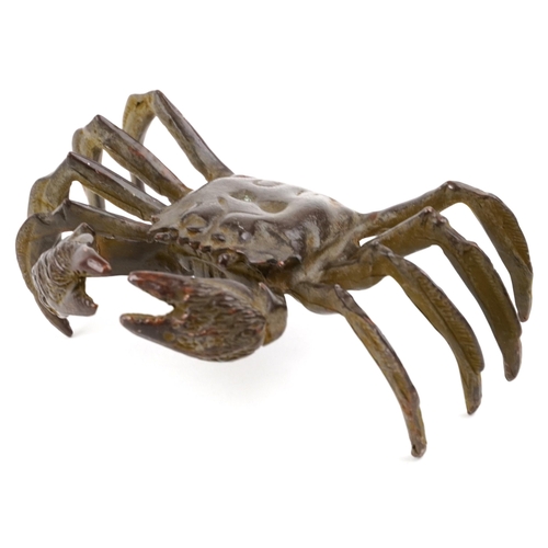 432 - A Japanese patinated bronze okimono of a crab, character marks to the base, 12cm wide.