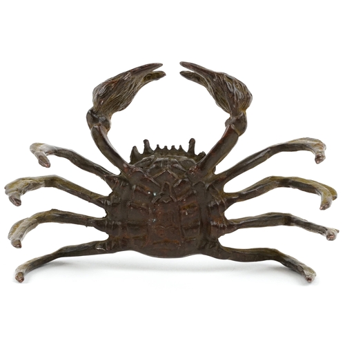 432 - A Japanese patinated bronze okimono of a crab, character marks to the base, 12cm wide.