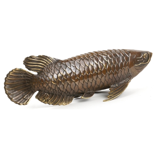 1078 - A Japanese patinated bronze okimono of a fish, 28.5cm in length.