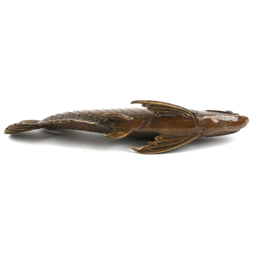 1078 - A Japanese patinated bronze okimono of a fish, 28.5cm in length.